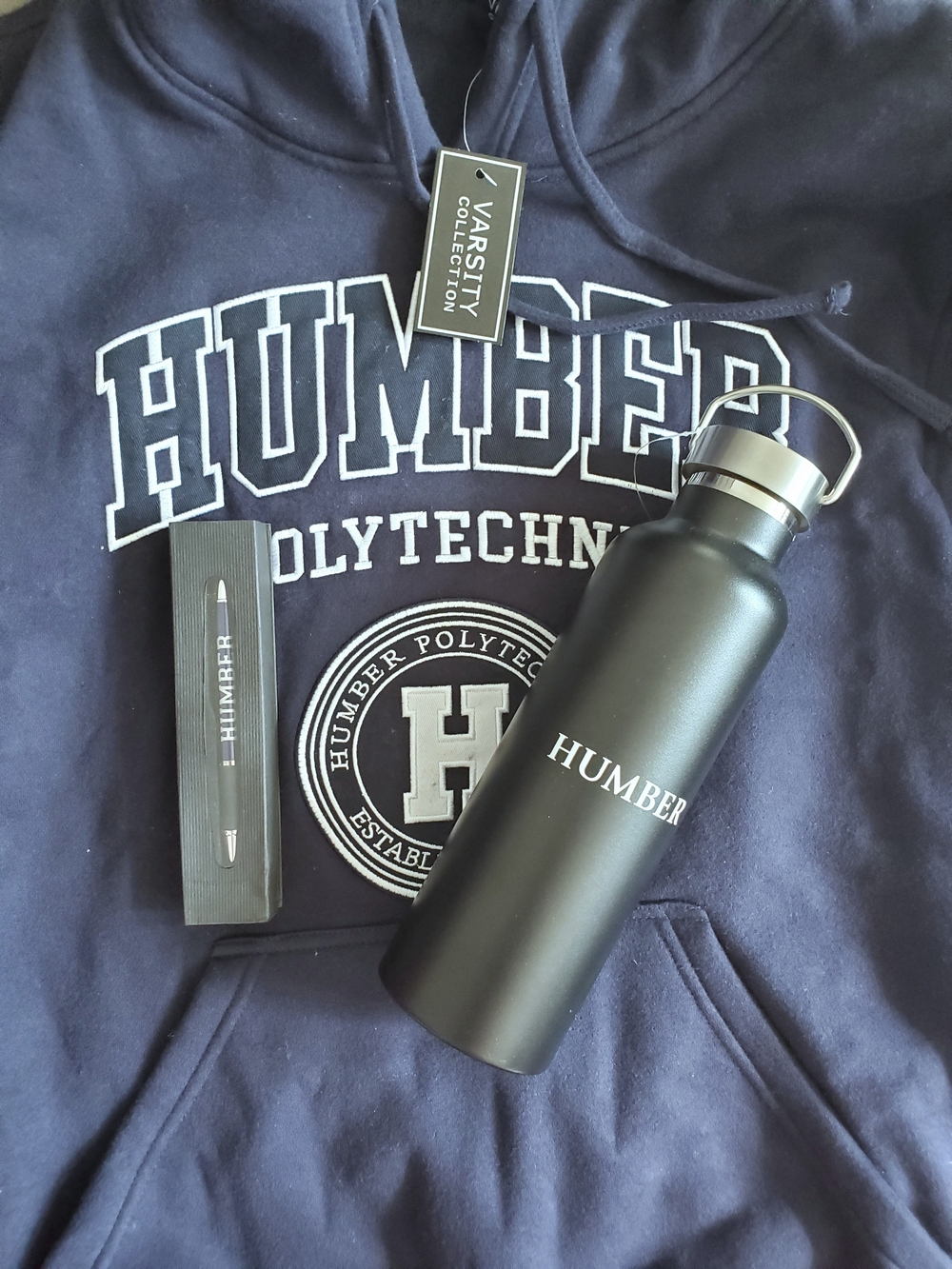 Brand New Humber Polytech Navy Hoodie with Drawstring Hood, with Bottle and Pen